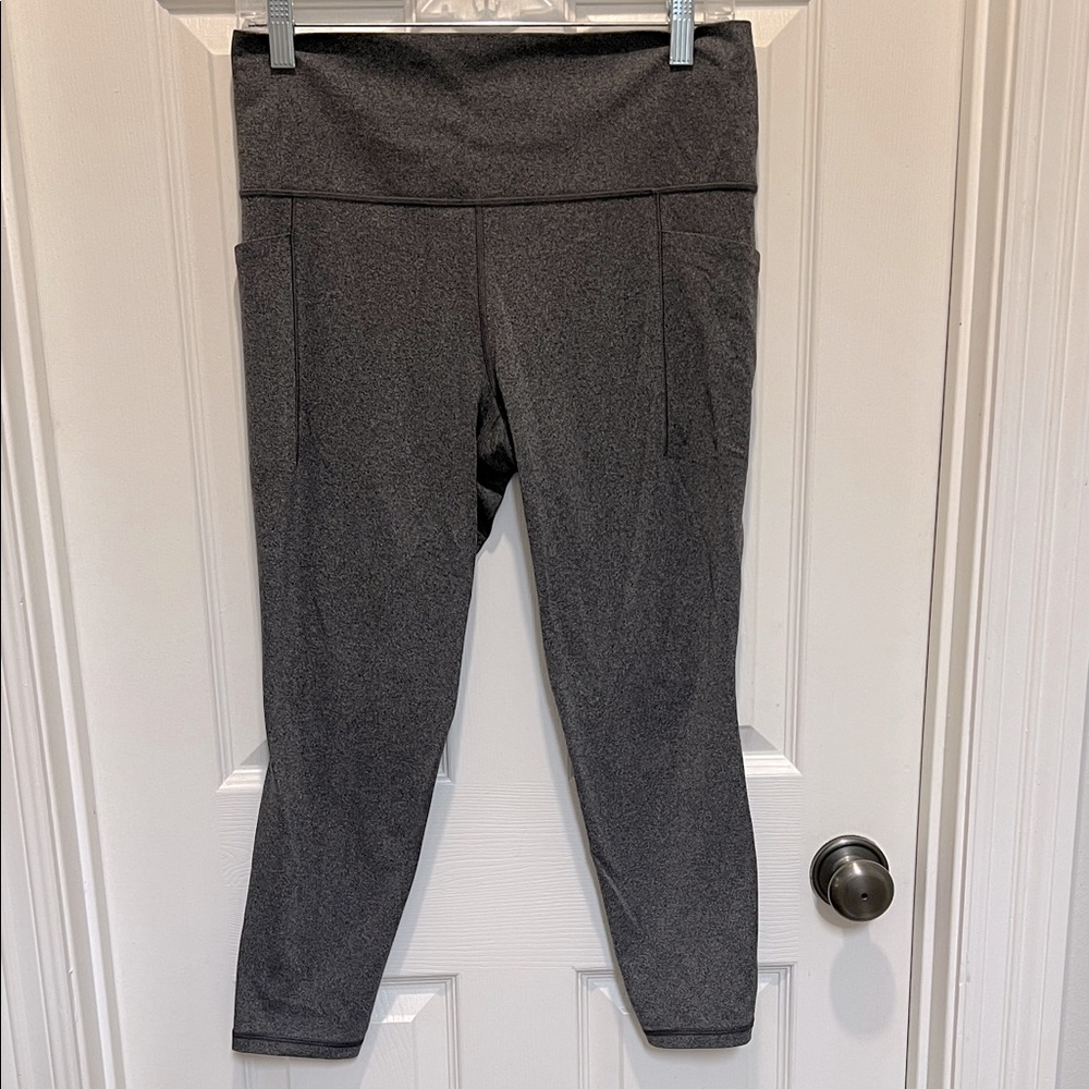Athleta Charcoal Grey Salutation 7/8 Tights with side pockets. Size Large.
